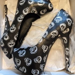 Brand new never worn black skull platform heels. 7 inch heel